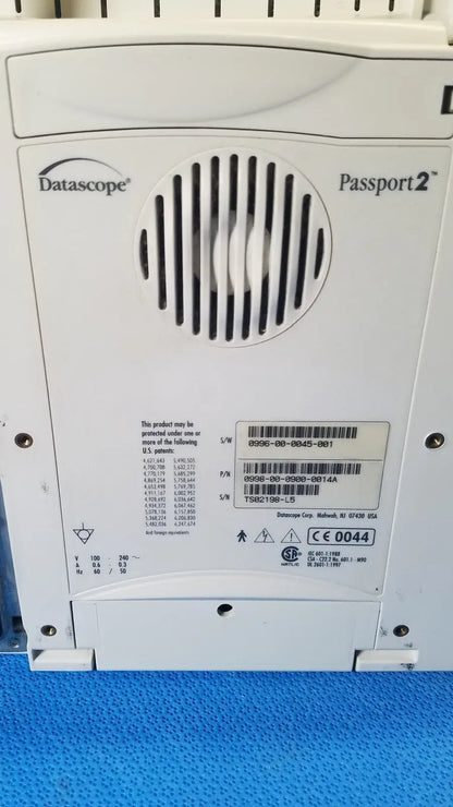 White datascope passport 2 ecg nibp ekg patient monitor control panel with circular vent grille and printed specifications