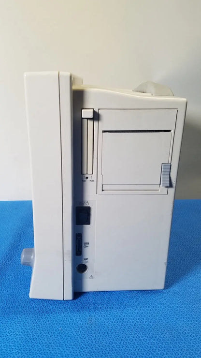 White plastic Datascope Passport 2 ecg nibp ekg patient monitor with vertical paper slot and multiple side ports