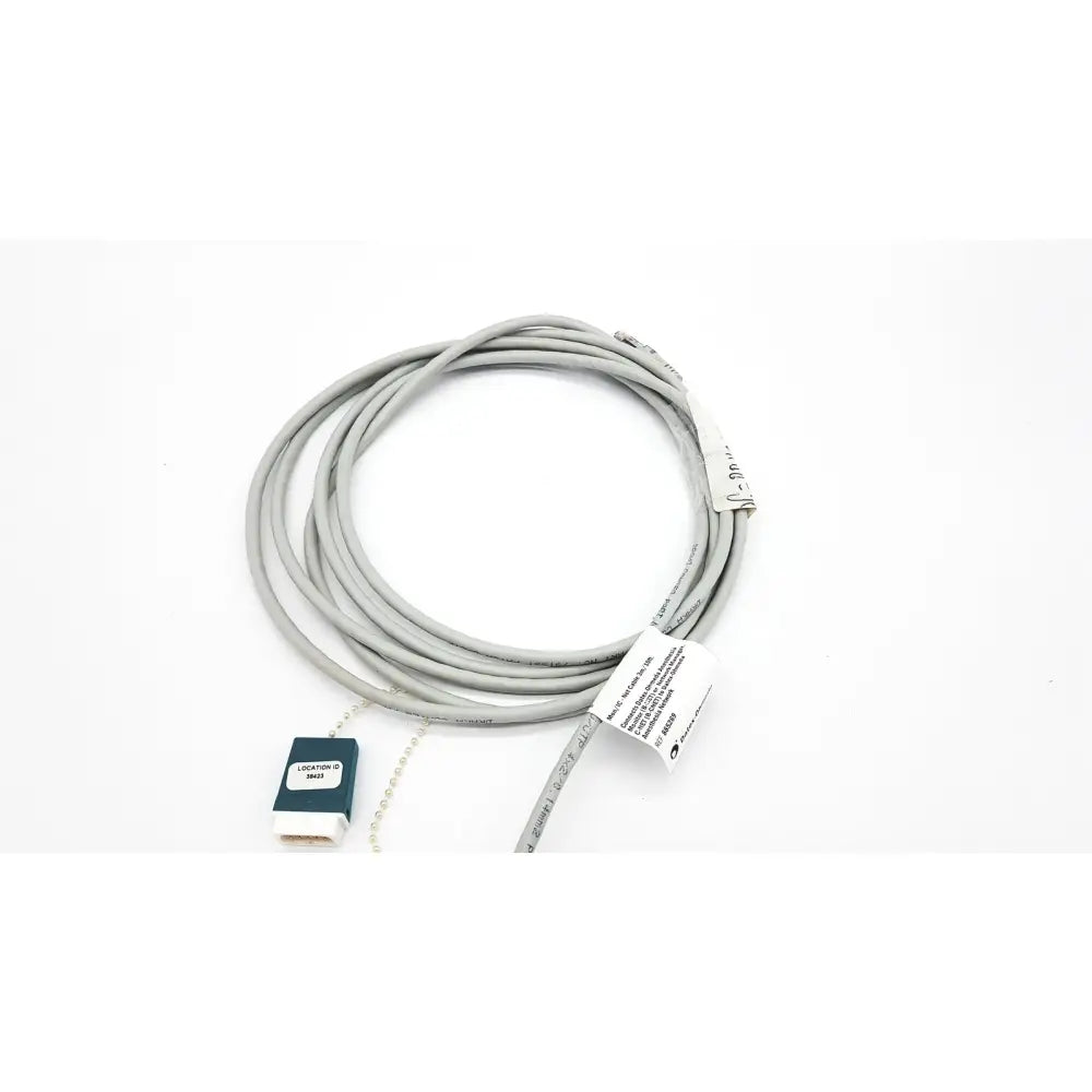 Gray coiled Datex Ohmeda network cable with dark green and white connector housing 10ft length for medical use