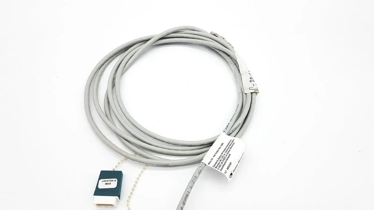 Gray coiled Datex Ohmeda network cable with dark green and white connector housing 10ft length for medical use