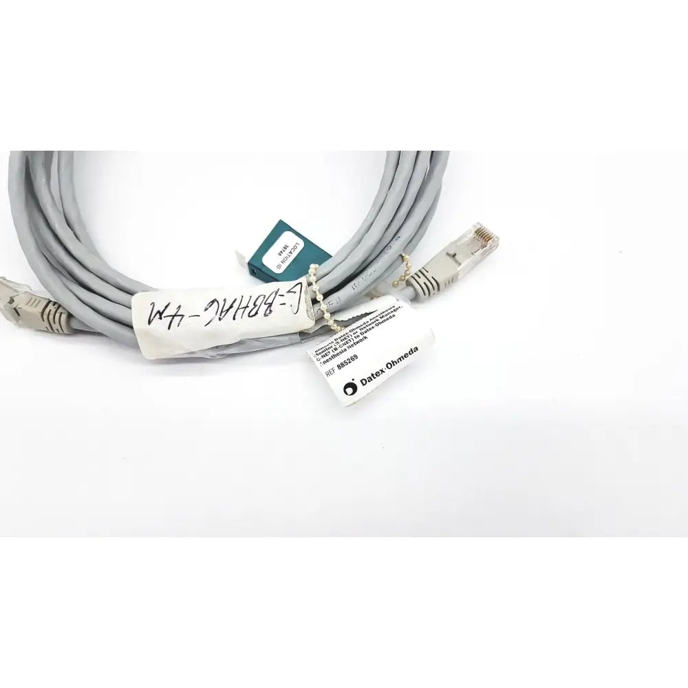Gray network cable with beige rj45 connectors and datex ohmeda label 10ft length for reliable connections