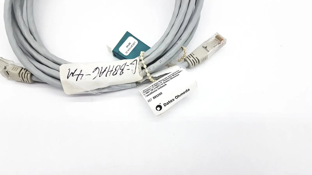 Gray network cable with beige rj45 connectors and datex ohmeda label 10ft length for reliable connections