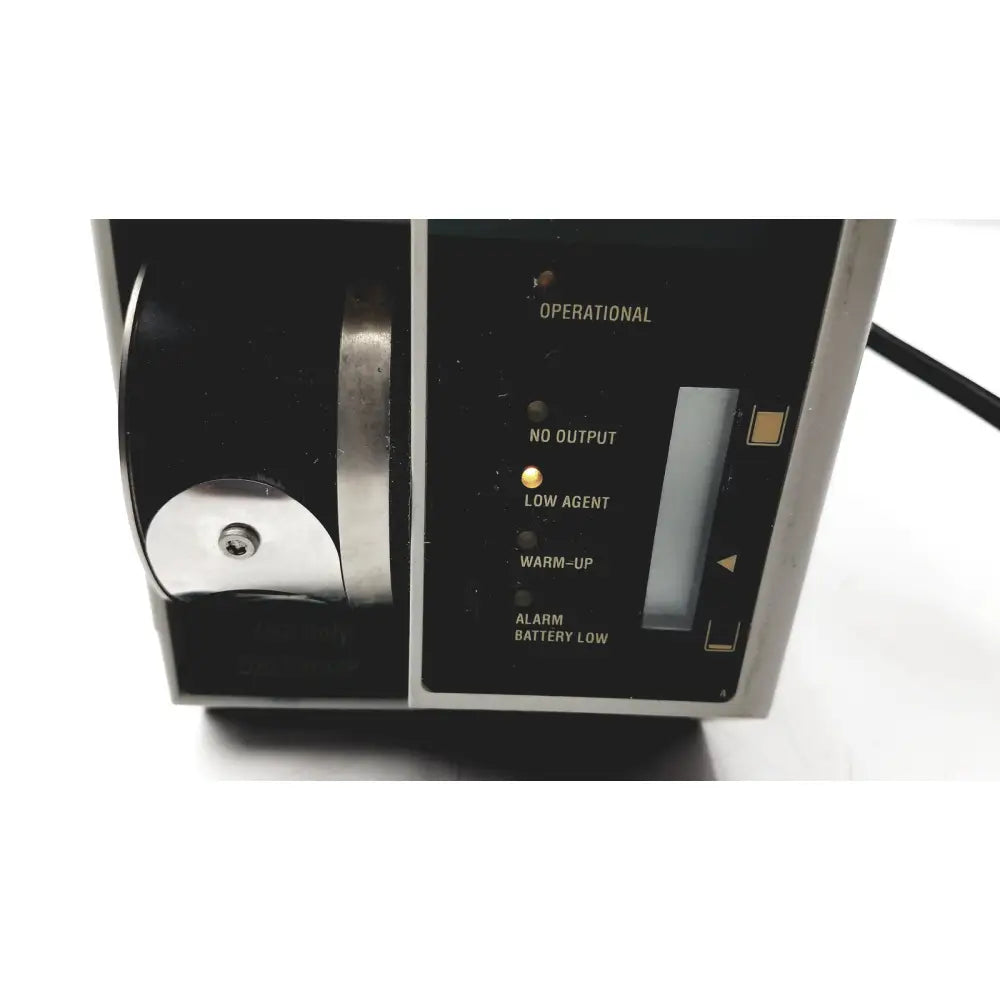 Black and silver datex ohmeda tec 6 desflurane anesthesia vaporizer with illuminated status indicators for precise anesthesia delivery