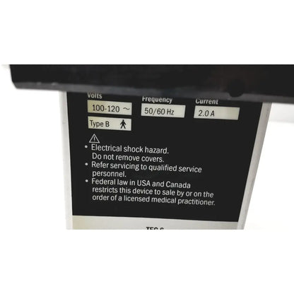 Black electrical specification label on the back of datex ohmeda tec 6 desflurane anesthesia vaporizer with voltage and safety details