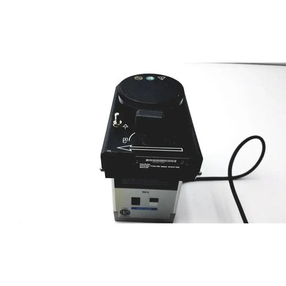 Black and silver industrial-grade Datex Ohmeda TEC 6 desflurane anesthesia vaporizer with circular control dial on top