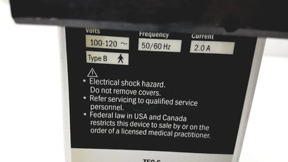 Black electrical specification label on the back of datex ohmeda tec 6 desflurane anesthesia vaporizer with voltage and safety details