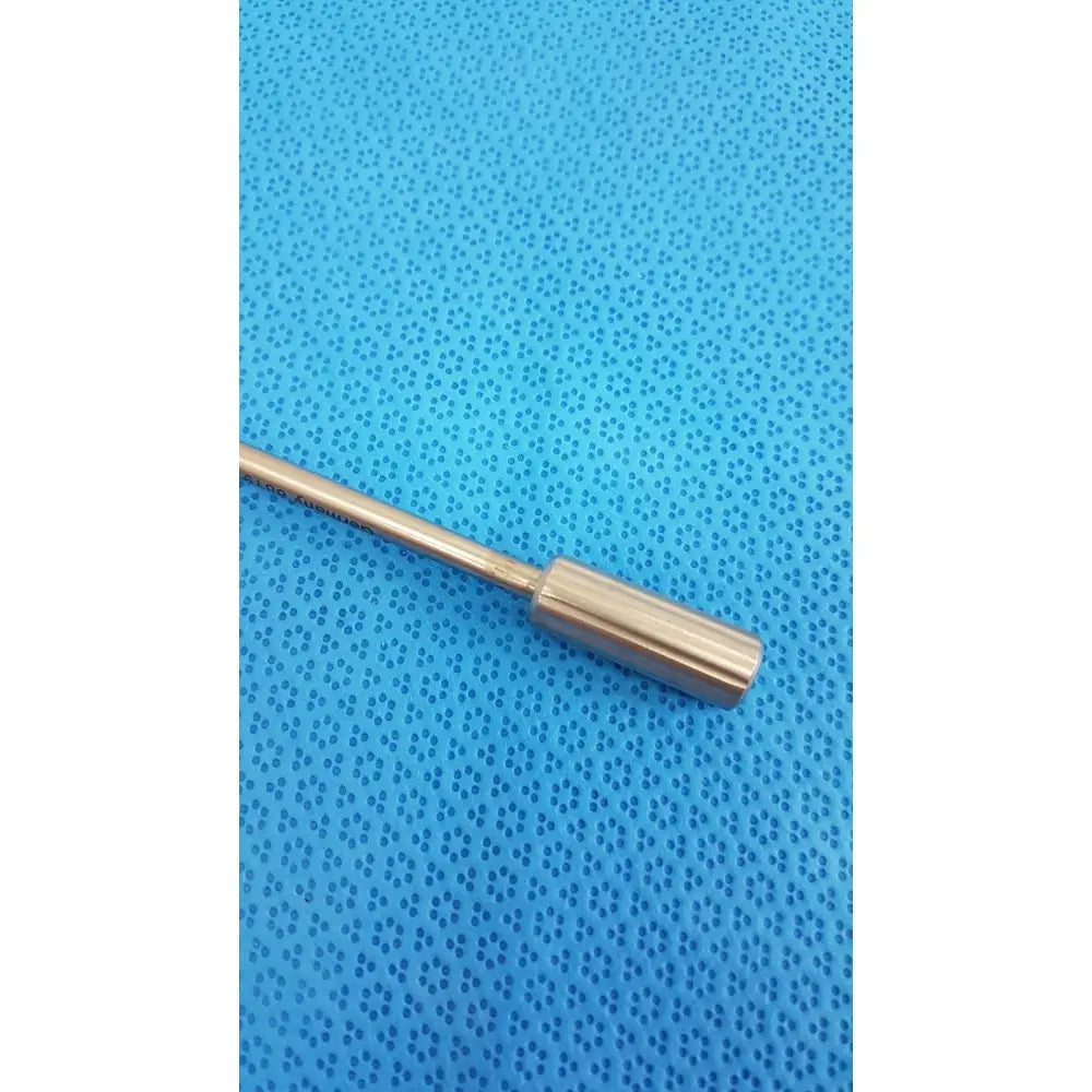 Davis + Geck surgical instrument model 8381-01 features a sleek metallic rod with a polished brass finish and rounded end cap