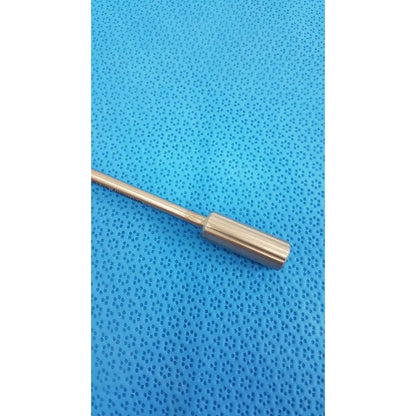 Davis + Geck surgical instrument model 8381-01 features a sleek metallic rod with a polished brass finish and rounded end cap