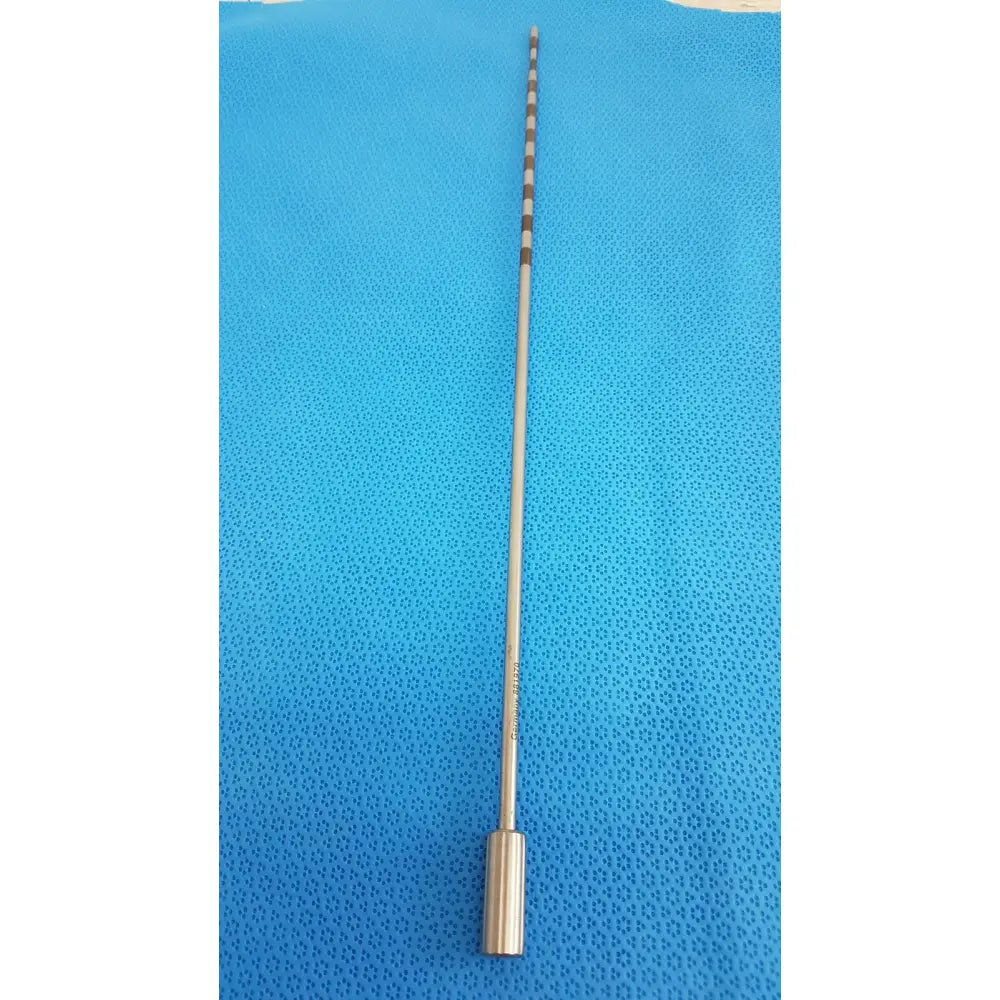A slender metallic surgical drill bit with polished silver finish and black and white stripes from geck surgical instrument model 8381-01 for reuse medical use