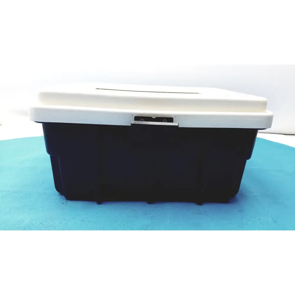 Black and white plastic defibrillator storage cabinet wall mount with silver latch for secure equipment storage
