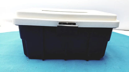 Black and white plastic defibrillator storage cabinet wall mount with silver latch for secure equipment storage