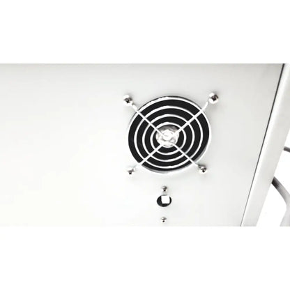 Silver circular fan grille with black concentric rings and four metallic balls on denton vacuum desk ii bench-top evaporator