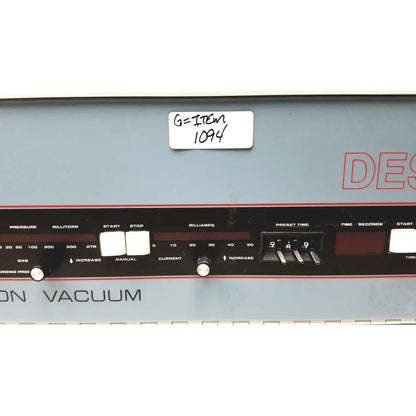 Gray industrial vacuum pump control panel with black dials and red lettering on denton vacuum desk bench-top system