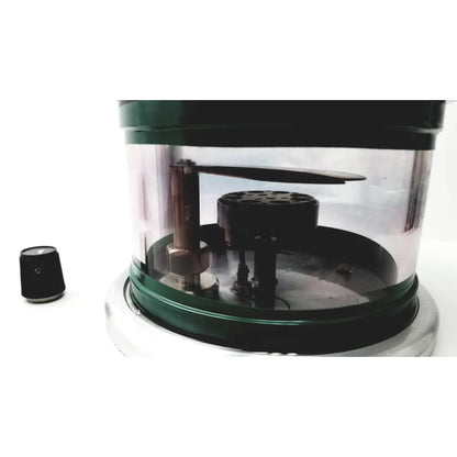 Green and clear cylindrical denton vacuum desk evaporator with metallic components and black circular base and top lid