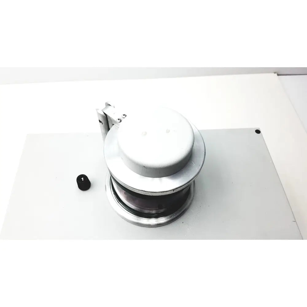 Silver metallic industrial pulley with circular housing and visible mechanism in denton vacuum desk ii sputtering system
