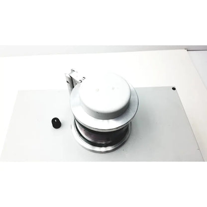 Silver metallic industrial pulley with circular housing and visible mechanism in denton vacuum desk ii sputtering system