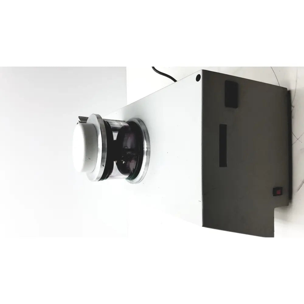 White rectangular denton vacuum desk ii bench-top evaporator with a circular metallic lens and black interior component