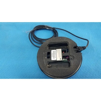 Black circular dentsply cavitron foot control with visible internal components and coiled cable serial no f062373