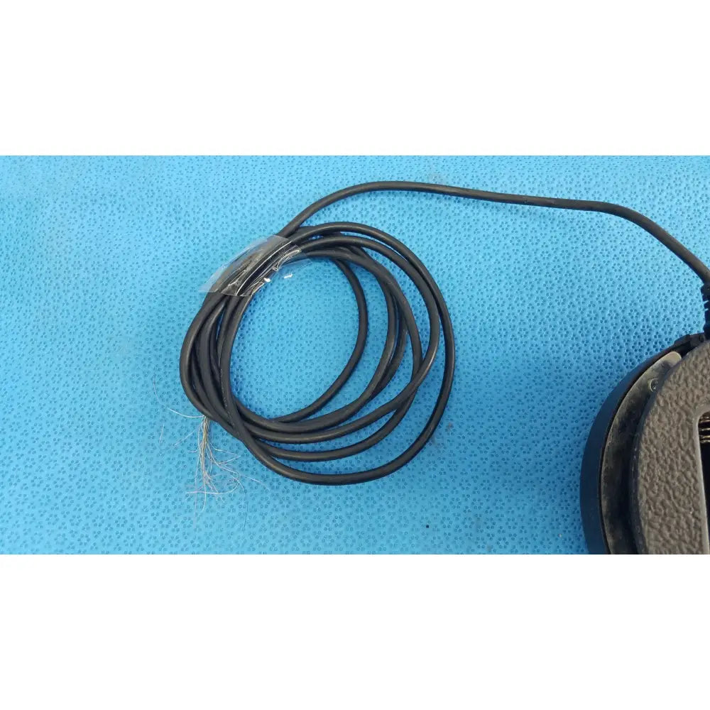 Black coiled cable with slight sheen partially wrapped in clear plastic for dentsply cavitron foot control serial f062373