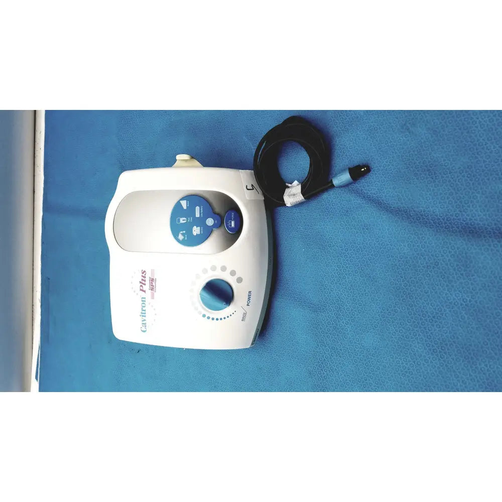 White dentsply cavitron plus ultrasonic scaling unit with blue control panel and coiled black cable for dental use