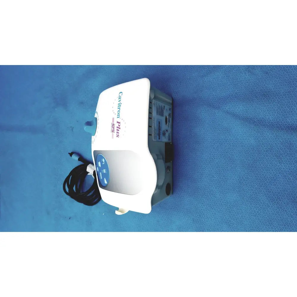 White and gray dentsply cavitron plus ultrasonic scaling unit with blue control panel for dental cleaning use