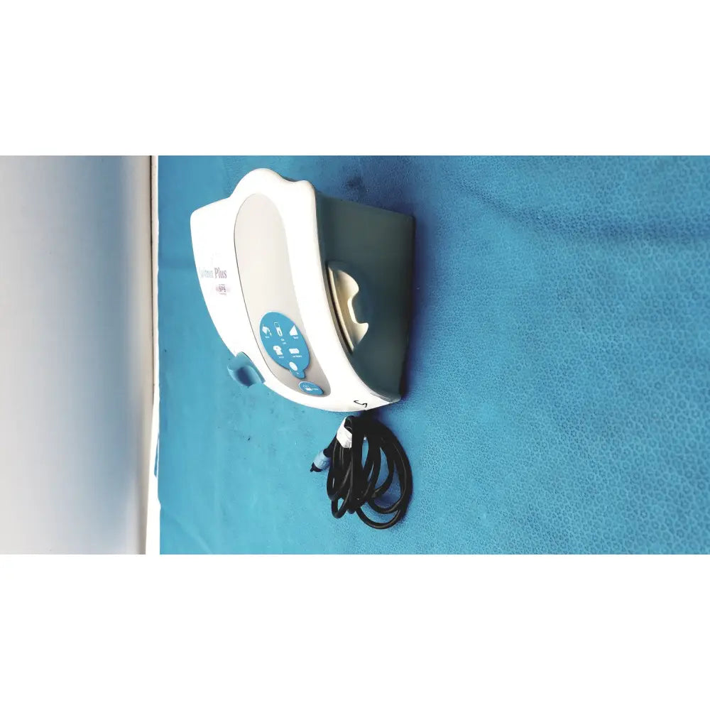 White and gray dentsply cavitron plus ultrasonic scaling unit with blue control panel labeled lumina plus for dental use