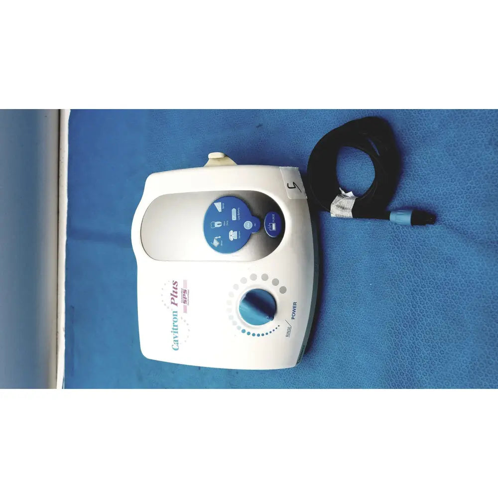 White dentsply cavitron plus ultrasonic scaling unit with blue control panel and coiled black hose for dental use