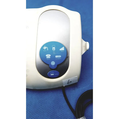White plastic dentsply cavitron plus ultrasonic scaling unit with blue circular control panel and rinse icons type gen-131