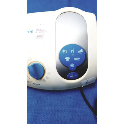 White and blue dentsply cavitron plus ultrasonic scaling unit type GEN-131 with circular control panel and function icons