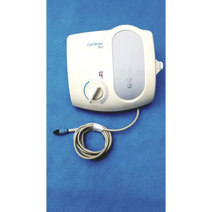 Dentsply cavitron plus ultrasonic scaling unit type gen-136 with white body, control panel, and beige coiled cable