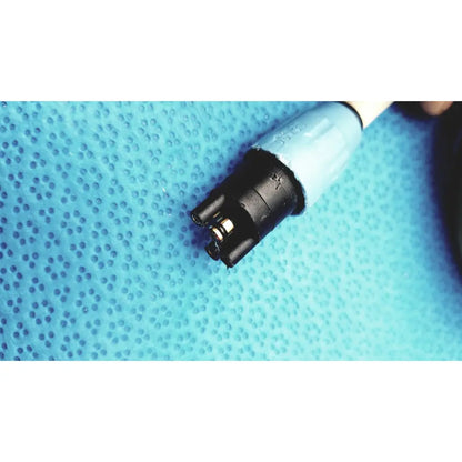 Light blue and black electrical connector with white cable on the back side of dentsply cavitron plus ultrasonic scaling unit type GEN-136