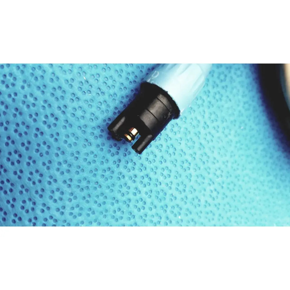 Black plastic connector with metallic contacts attached to translucent blue tube for dentsply cavitron plus ultrasonic scaling unit