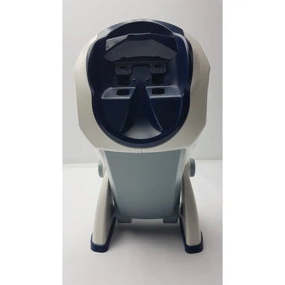 Cream-colored and navy blue plastic robotic dog with open face showing components in the depisteo vt1 vision screener