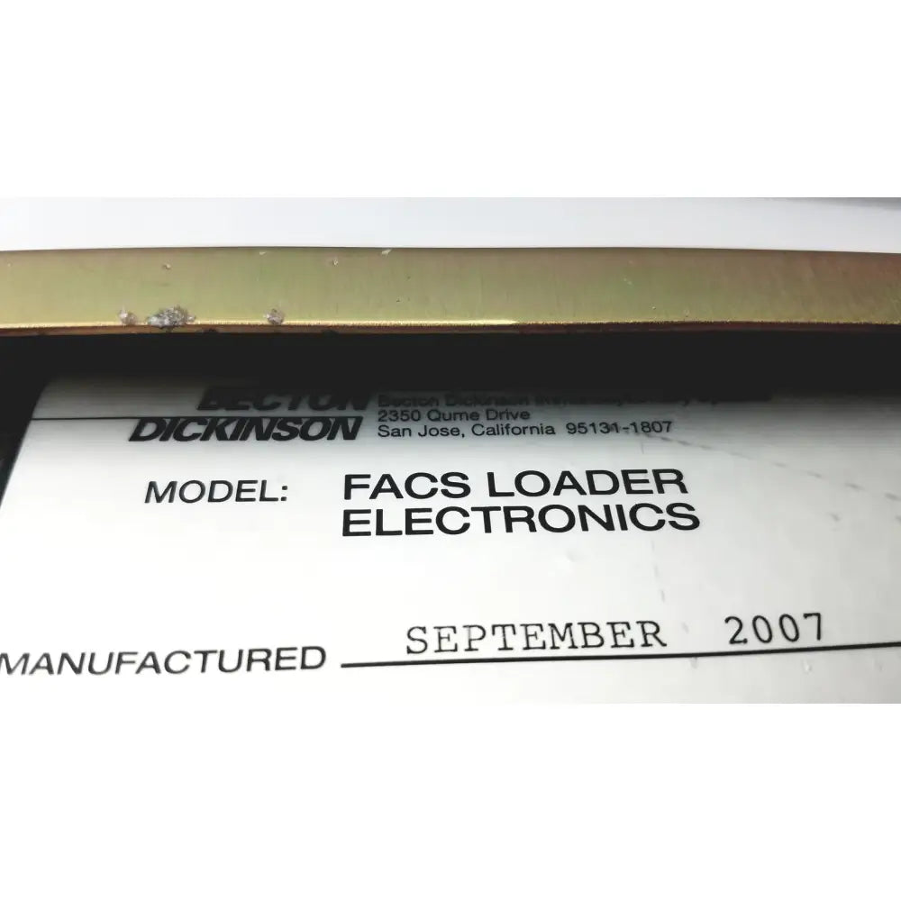 White label with black text identifying dickinson facs loader electronics interface module manufactured september 2007