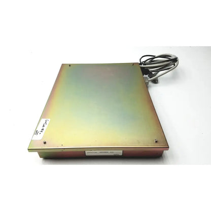 Rectangular metallic dickinson facs loader electronics panel with green to gold gradient and attached cables