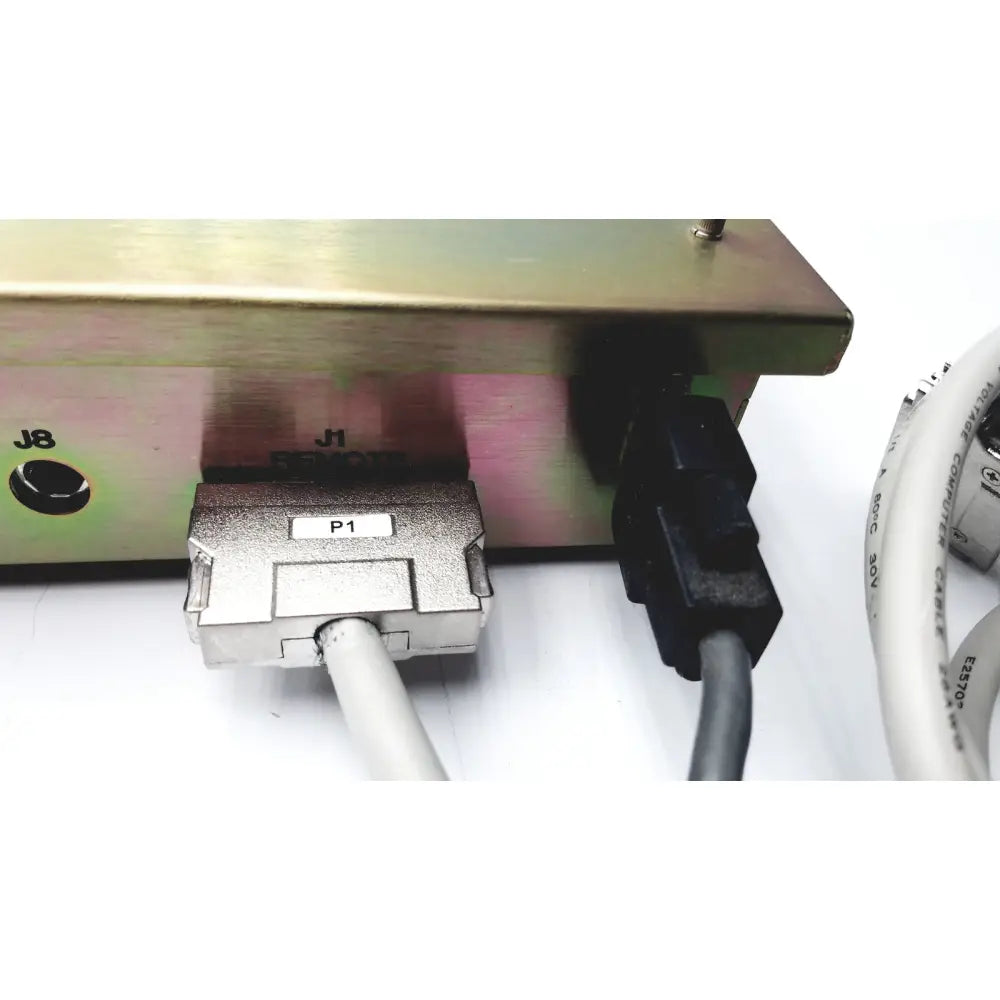 Silver metallic industrial connector p1 with two white cables on the back of dickinson facs loader electronics module