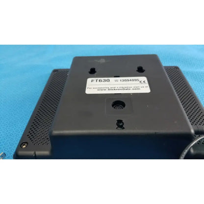 Black plastic back panel of dickson data logger ft630 with perforated ventilation grilles and white model label