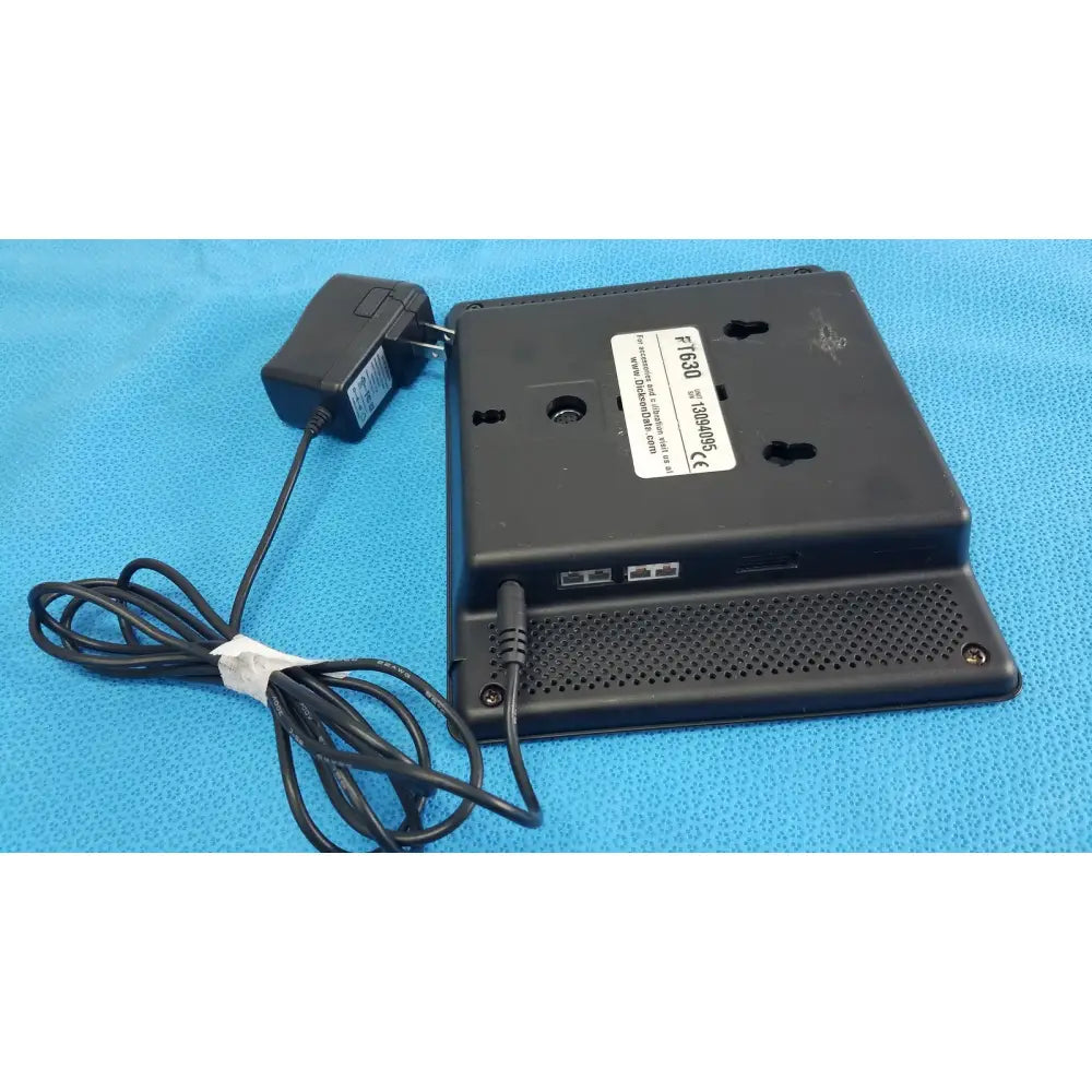 Black plastic dickson data logger ft630 with power adapter and coiled cable for precise data recording