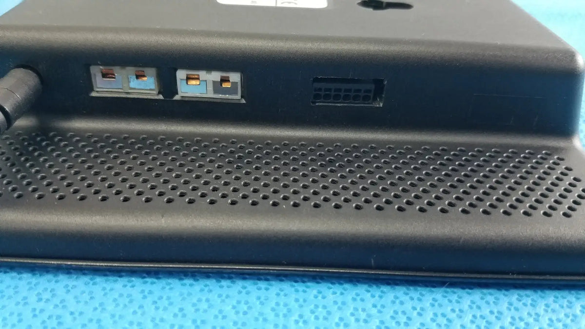 Black plastic dickson data logger model ft630 with perforated front panel and multiple ports on the back side