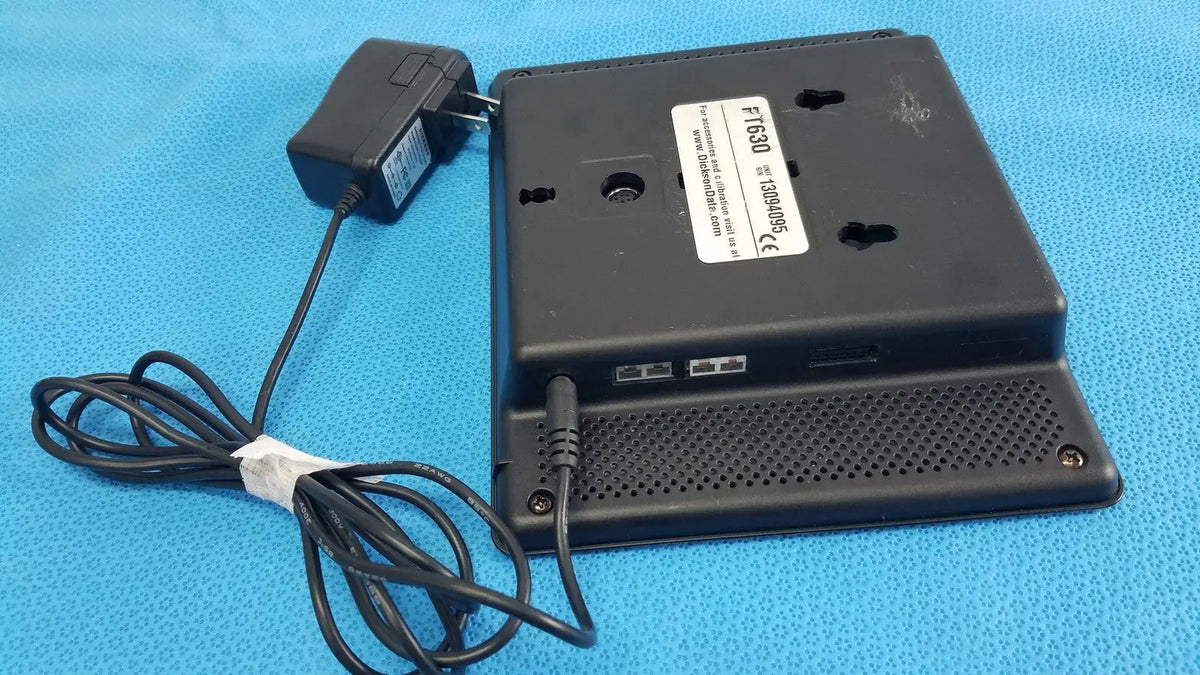 Black plastic dickson data logger ft630 with power adapter and coiled cable for precise data recording
