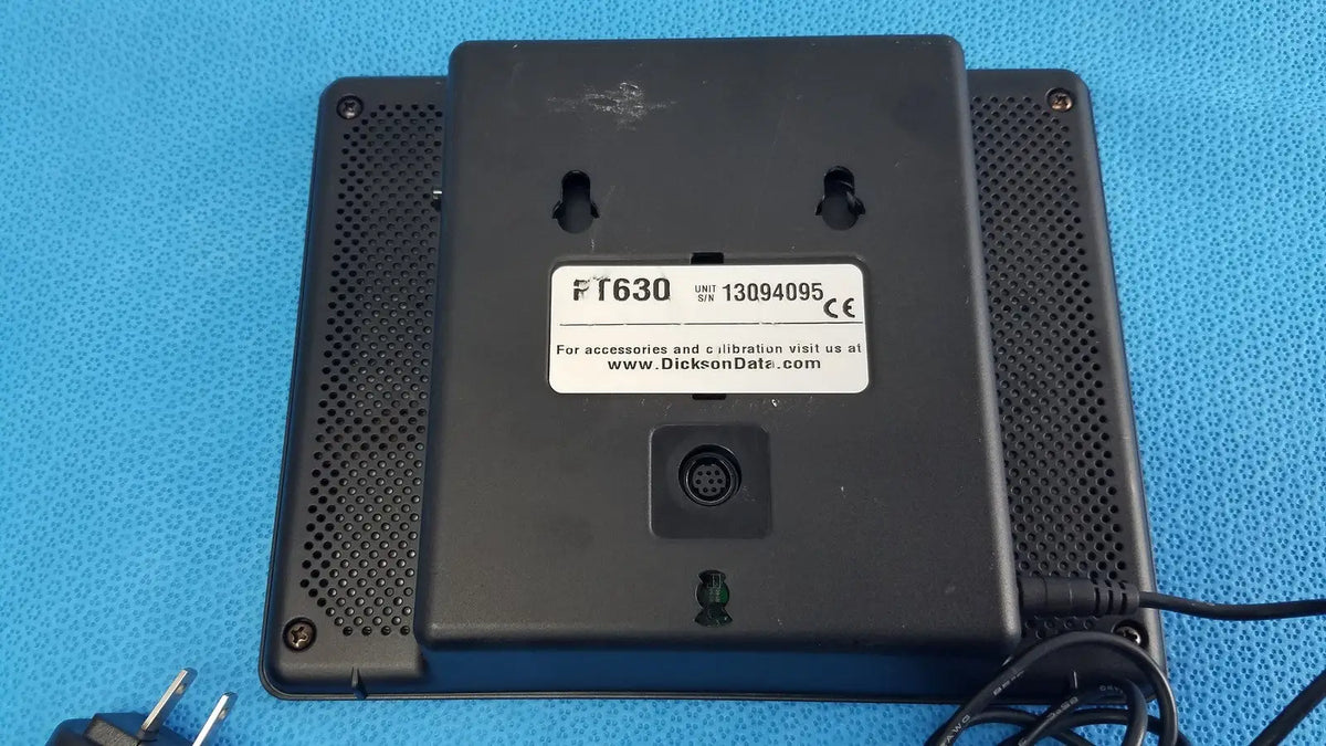 Black plastic dickson data logger ft630 with perforated back panel and label showing model number and ce mark