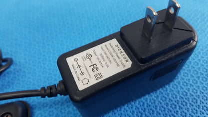 Black plastic dickson data logger ac adapter with two-prong plug and attached power cord for model ft630 recorder