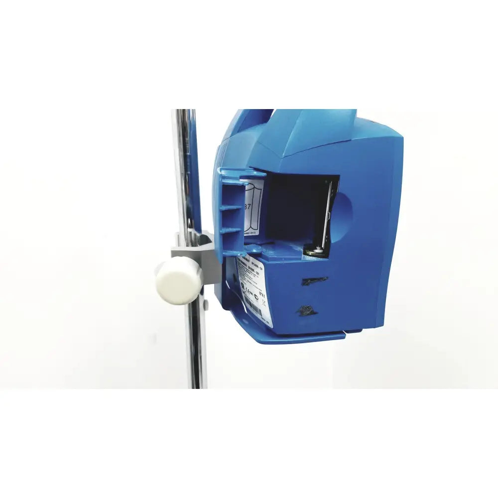 Blue plastic medical infusion pump with white adjustment knob on dinamap dcp400n-en patient monitor with stand