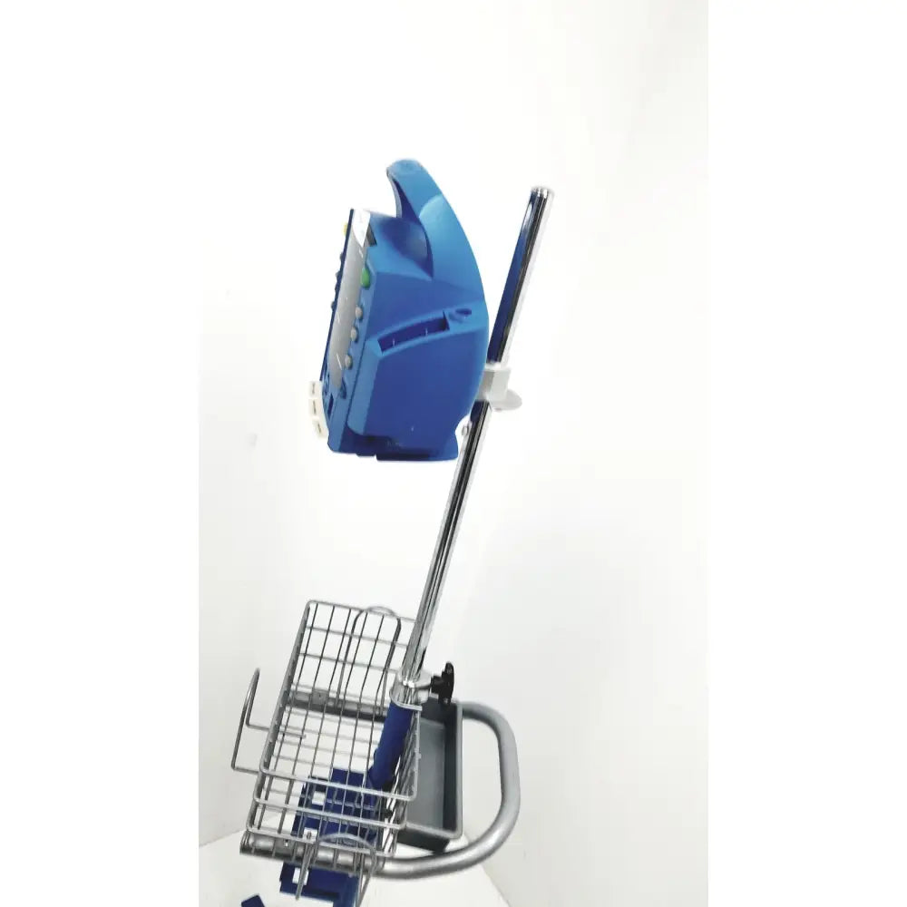 Blue plastic handheld scanner mounted on metal stand with wire basket for dinamap dcp400n-en patient monitor use