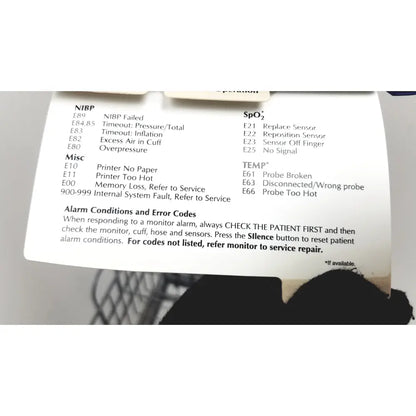 White paper label with black printed medical monitor error codes on the dinamap dcp400n-en patient monitor product