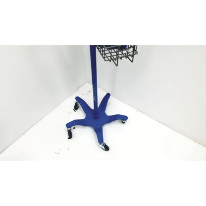 Blue star-shaped Dinamap V100 vital signs monitor cart with black casters and metal basket on rolling stand