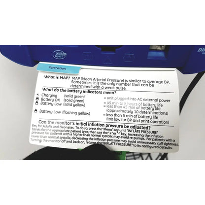 Blue max brand instruction label with white text on paper sheet for dinamap v100 vital signs monitors with rolling stand