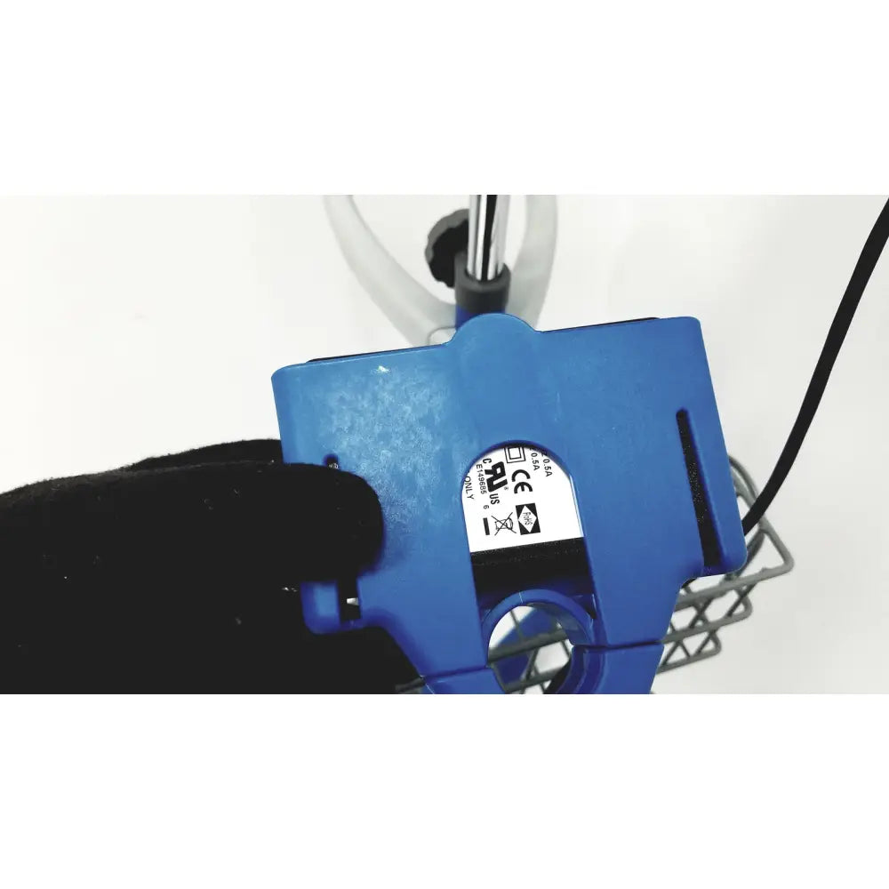 Blue plastic clamp with certification label and black wire on the back of dinamap v100 vital signs monitors with rolling stand