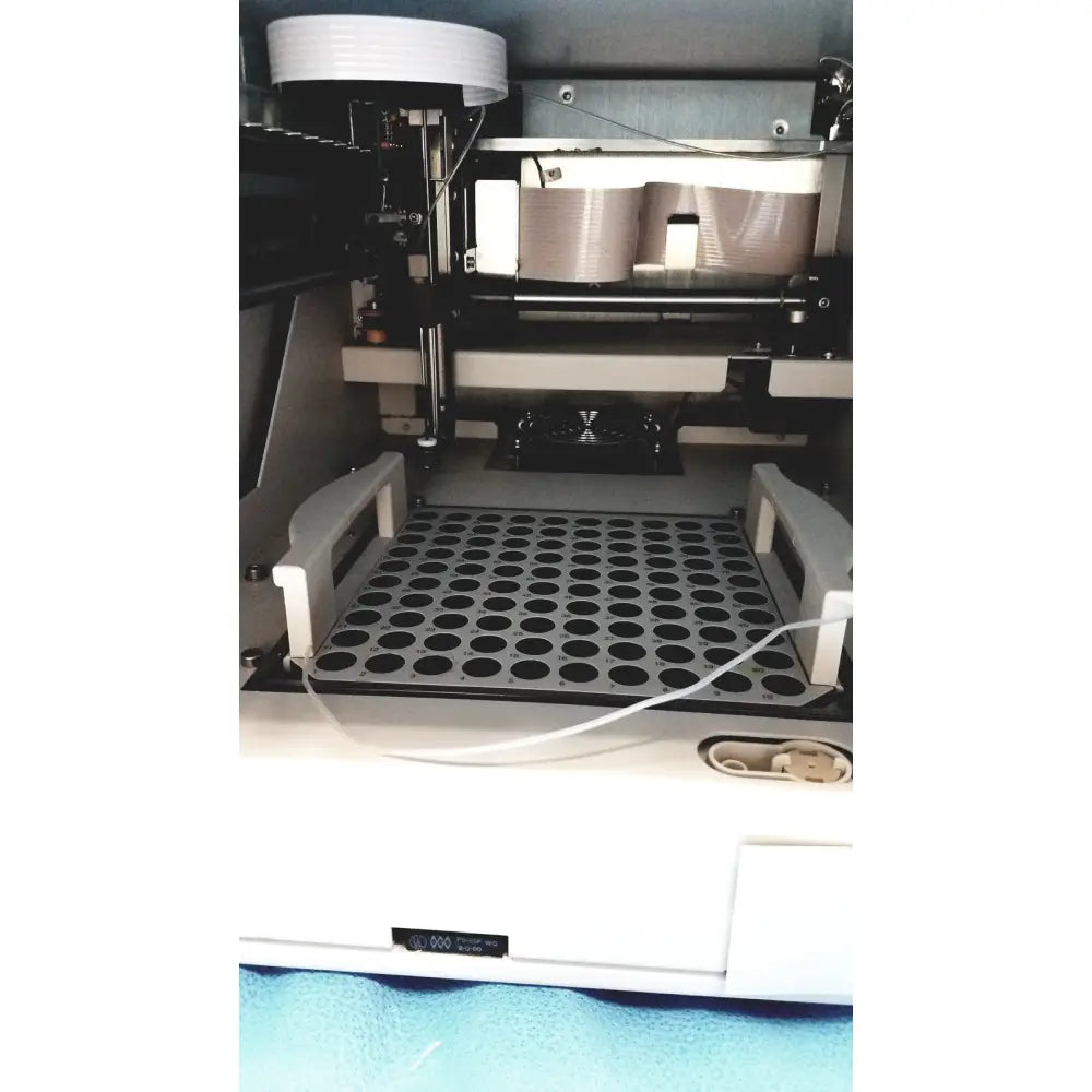 White dionex as50 autosampler with perforated tray and metallic components for chromatography systems
