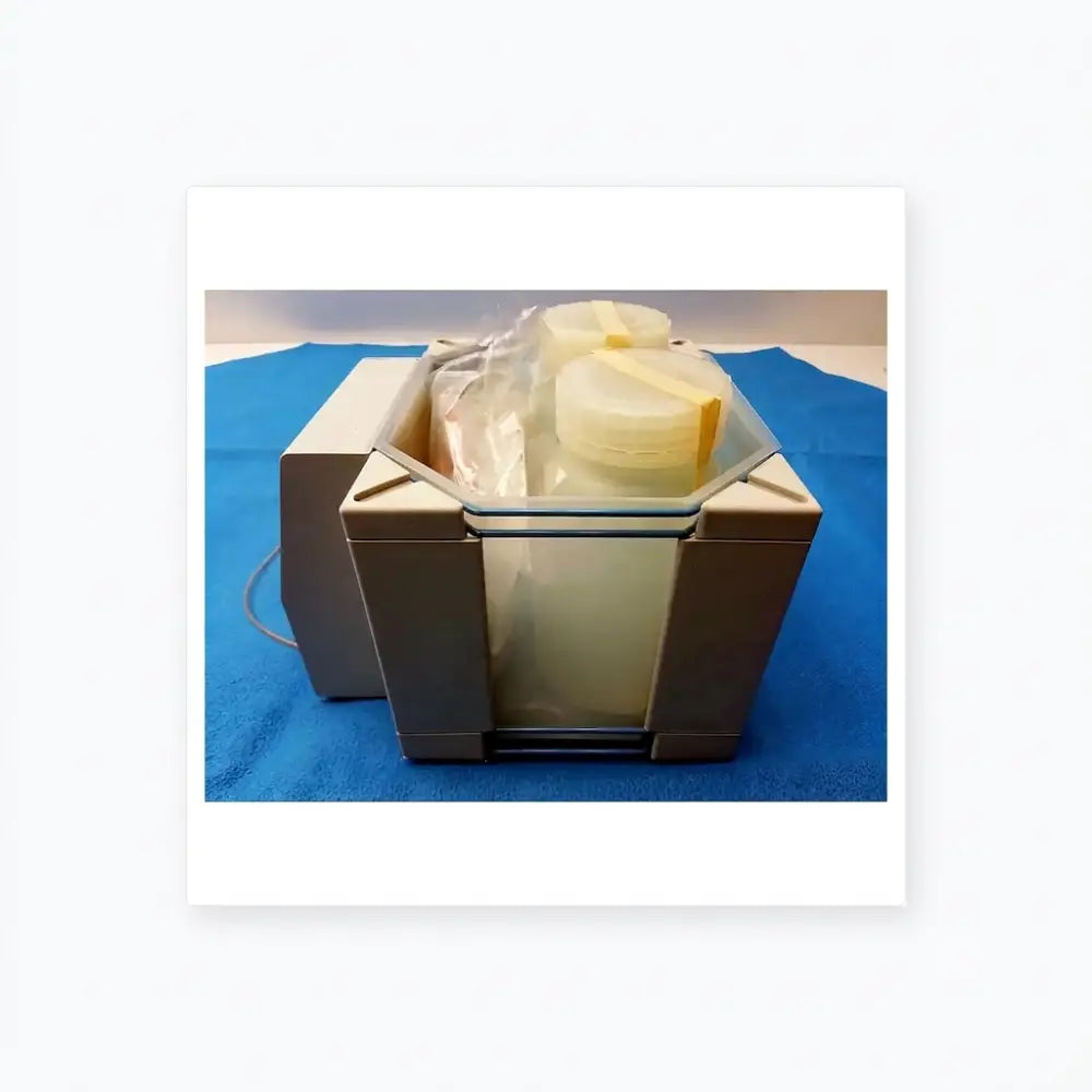 Beige plastic dionex pc-10 pneumatic controller with transparent lid and yellowish contents inside for precise control